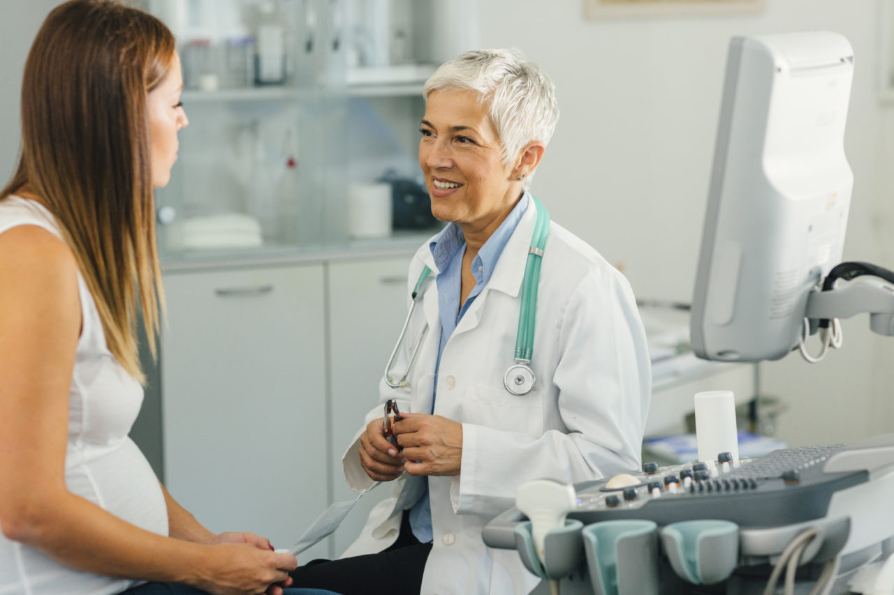 Pregnant Woman And Her Female Doctor In A Consultation. - Insception ...